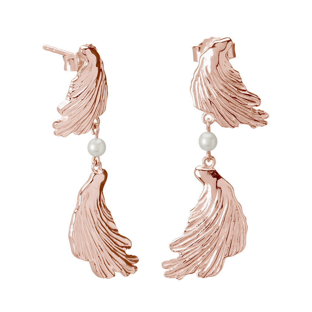 Rose gold statement earrings with a contemporary and abstract design, inspired by love letters and ancient jewellery. 