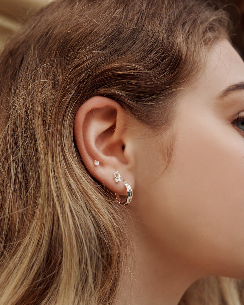 Handcrafted artisanal silver hoops that make a statement. Made with artisanal production methods and nickel and lead-free. 