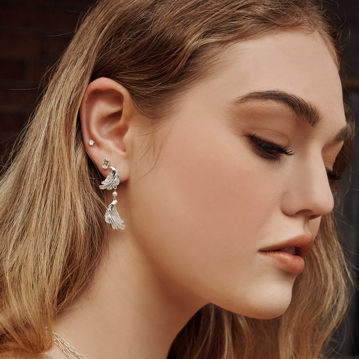 Modern earrings feature a textural aesthetic, evoking a sense of nostalgia. Inspired by love letters and ancient jewellery.