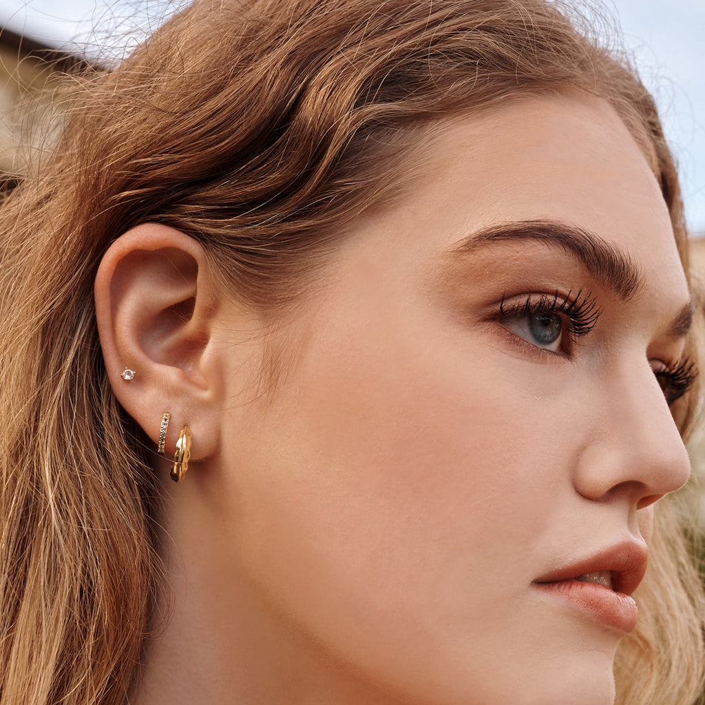Stylish gold hoops, free from nickel and lead. Textural, modern earrings are a whimsical nod to nostalgia. 