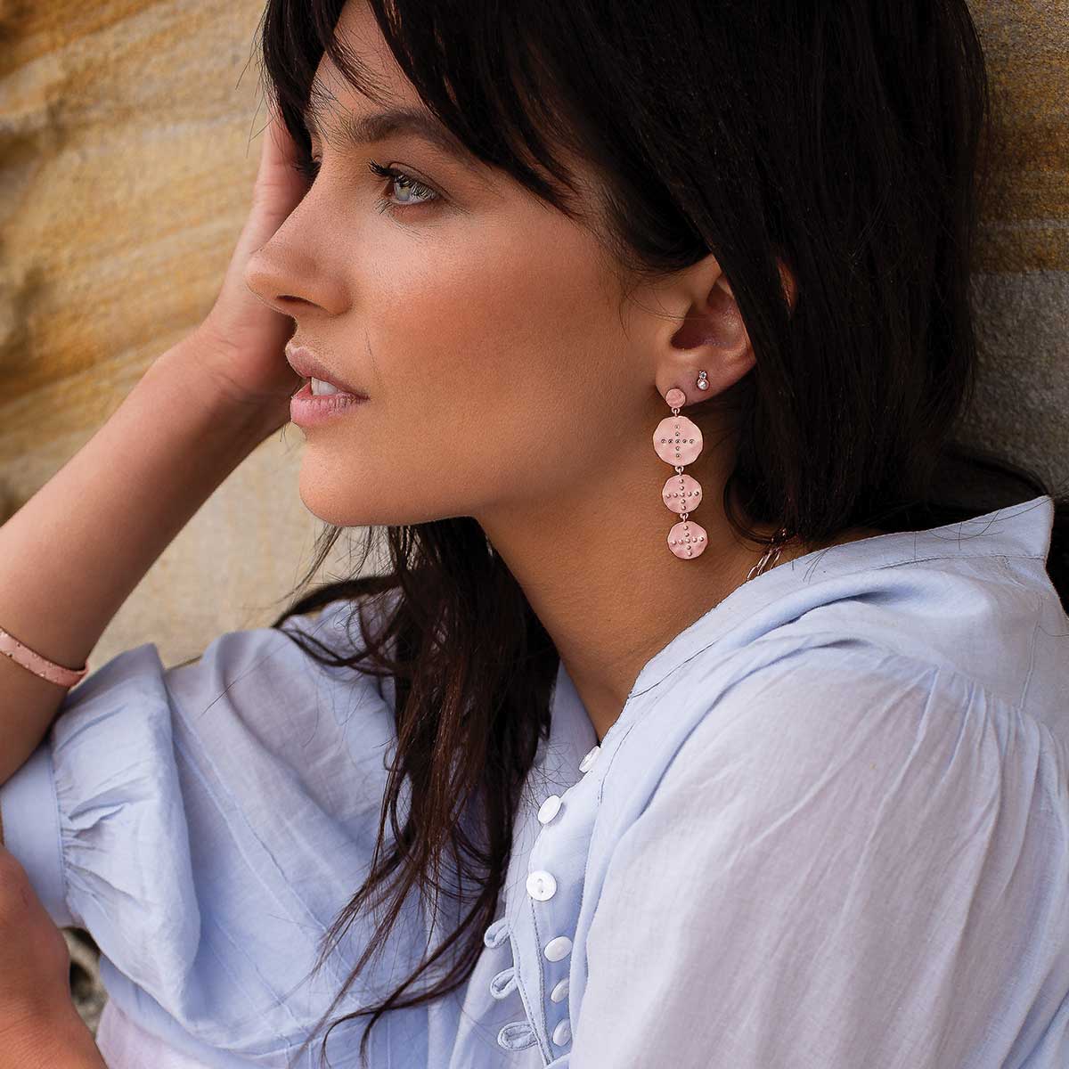 Ethically produced rose gold statement earrings with ancient symbolism. Unique and timeless addition to any collection.