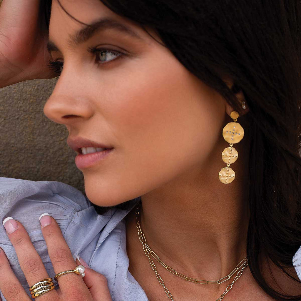 Handcrafted statement gold earrings featuring natural materials with a Celtic design. Meaningful and timeless earrings. 