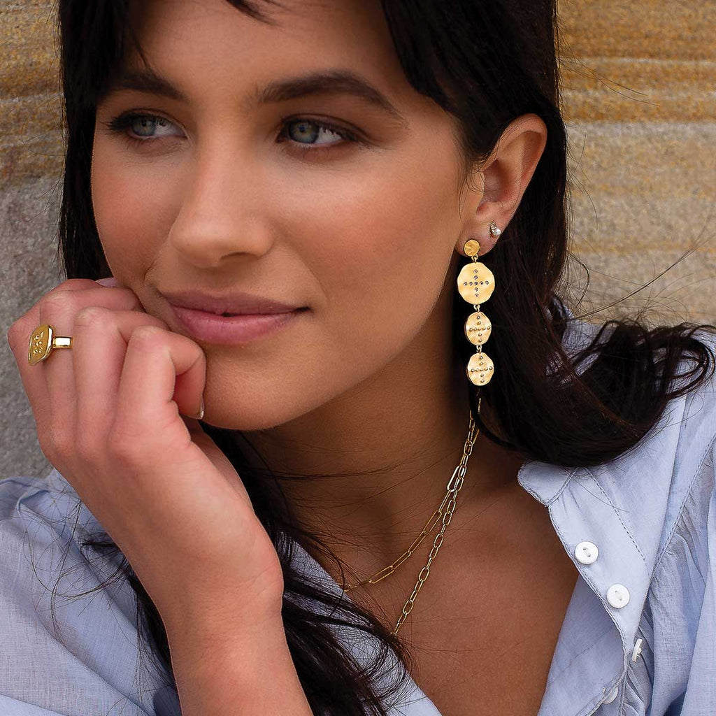 Handcrafted statement gold earrings featuring natural materials with a Celtic design. Meaningful and timeless earrings. 